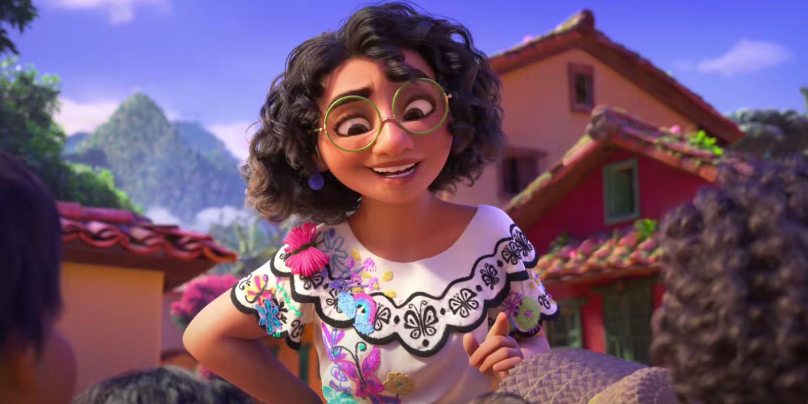 Mirabel looks down on some children in Disney's Encanto.