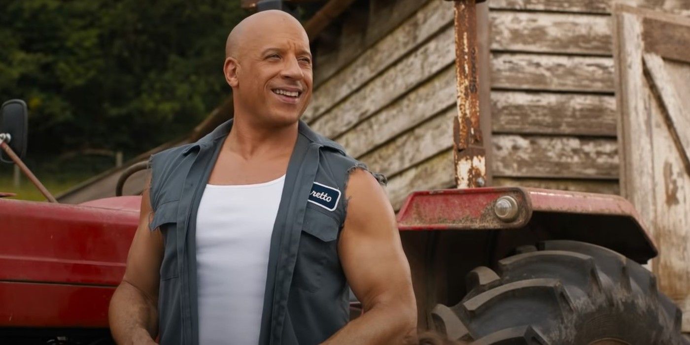 Vin Diesel as Dom working on a car in F9