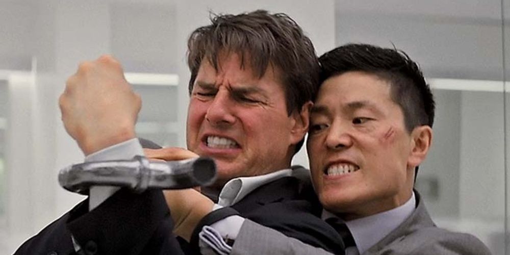 Fake John Lark holds a pipe to Ethan's throat in Mission Impossible Fallout