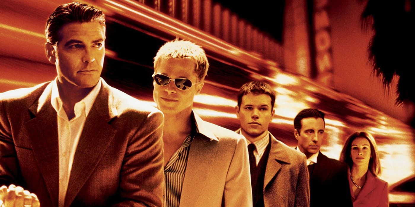 George Clooney, Brad Pitt and Matt Damon standing together in Ocean's Eleven.