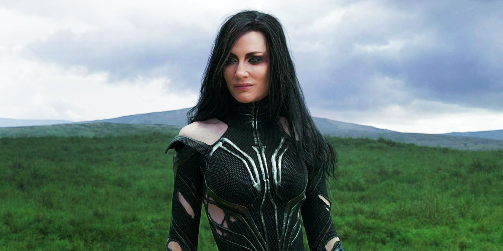 Hela standing in an open field in Thor: Ragnarok.