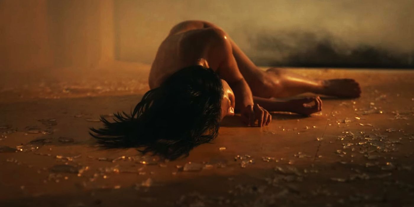 Jeong-ja laying naked on the ground surrounded by shattered glass in Hellbound.