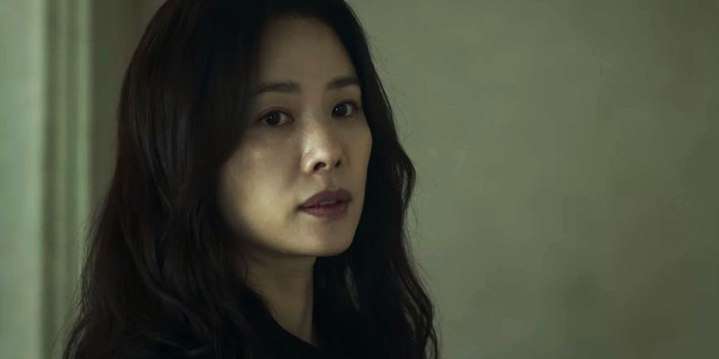 Min Hye-jin looks at someone offscreen in Hellbound.