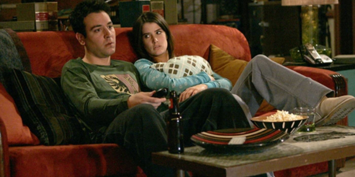 Ted and Robin looking upset while sitting on a couch in HIMYM