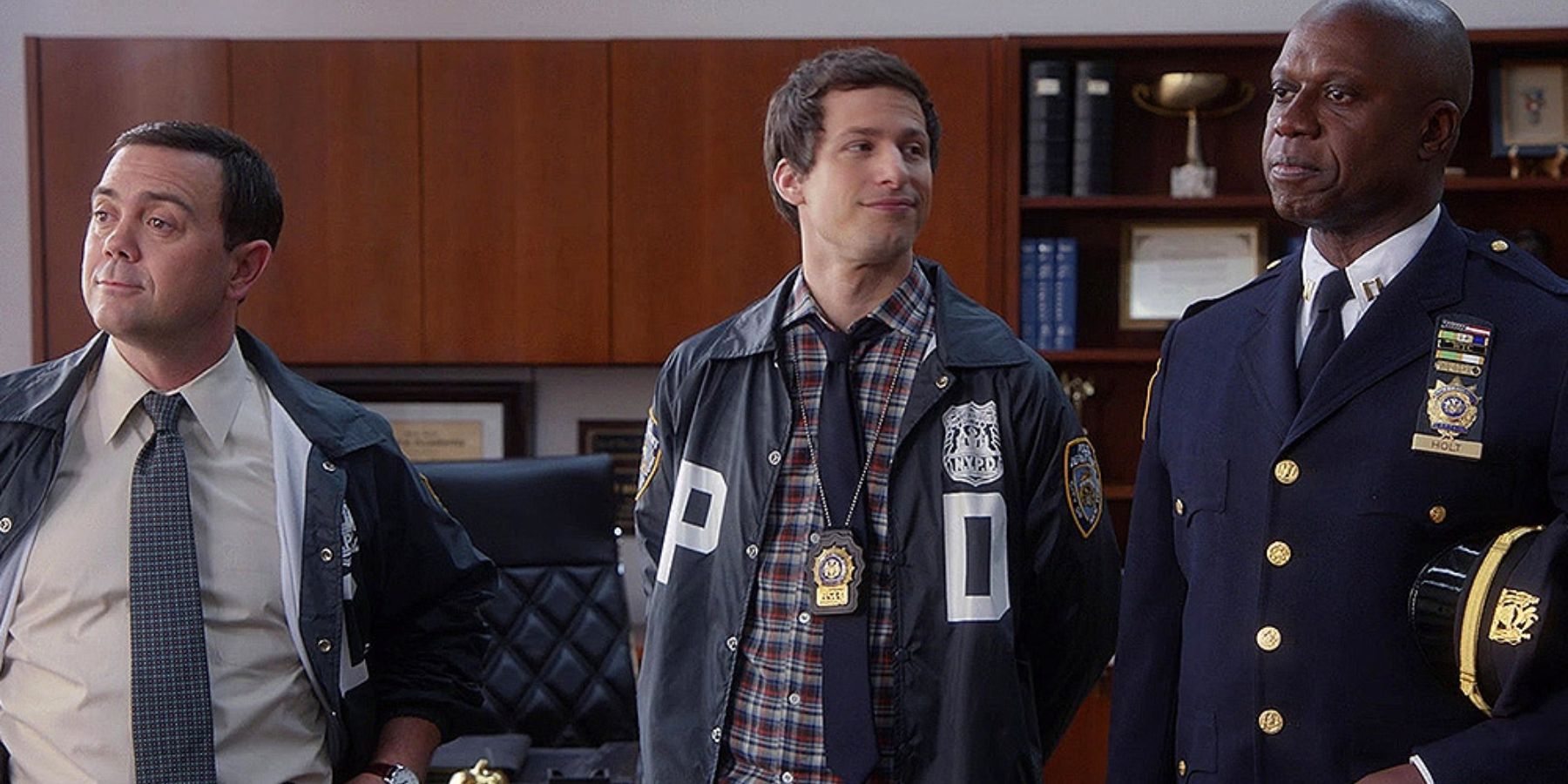 Jake. Charles, and Holt standing next to each other in Brooklyn Nine-Nine