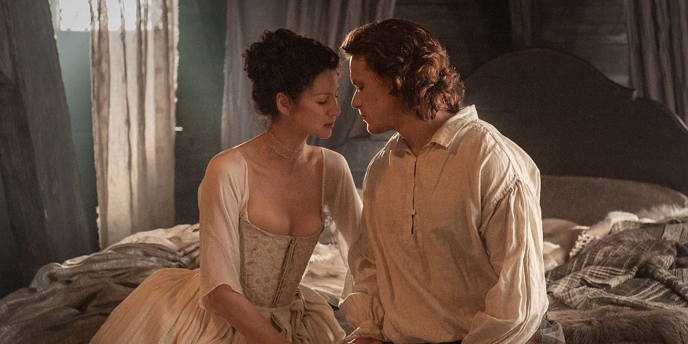 Jamie and Claire about to kiss on their wedding night in Outlander