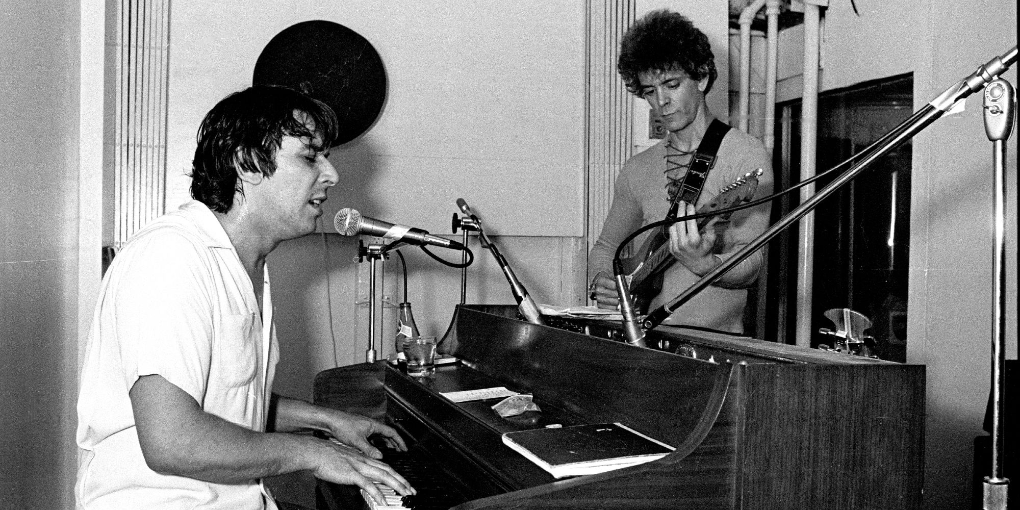 Frenemies John Cale and Lou Reed play music together in the studio during the late 1960s.