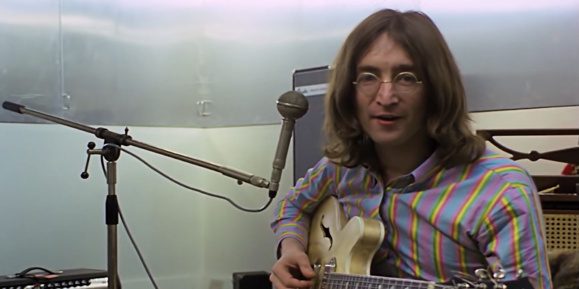 John Lennon plays the guitar in The Beatles: Get Back.