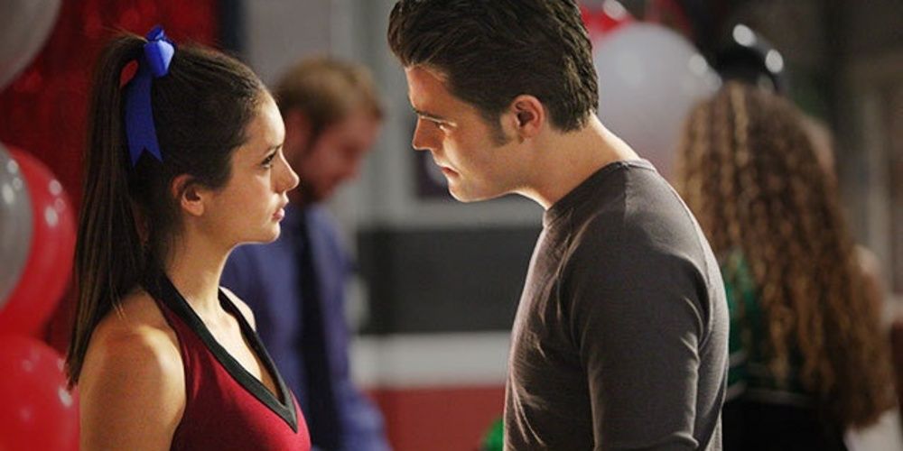 Elena wears a cheerleader outfit and argues with Stefan in The Vampire Diaries
