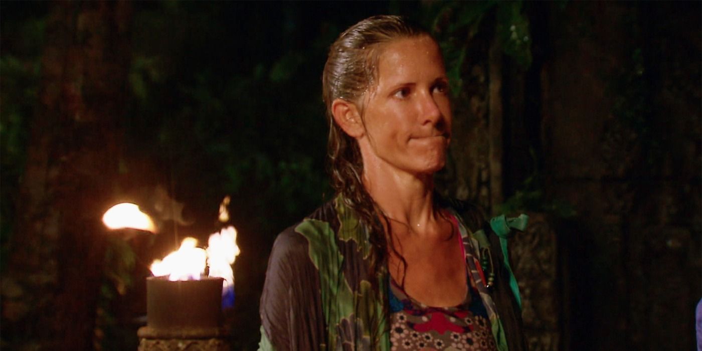 Kelly Wigglesworth wet from the rain at Tribal Council in Survivor: Borneo