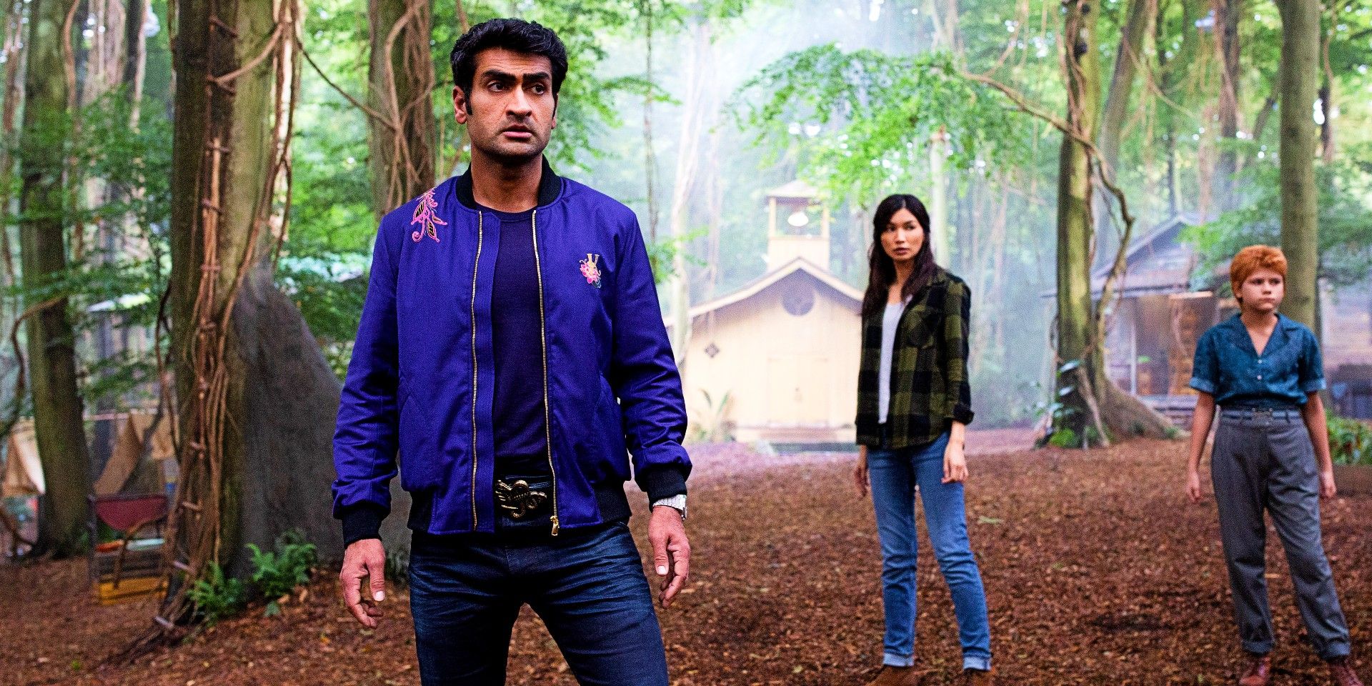 Kumail Nanjiani and Gemma Chan in the woods in Eternals
