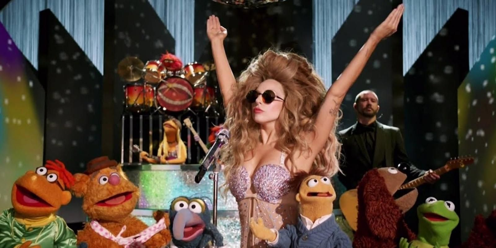 Lady Gaga surrounded by the Muppets in Lady Gaga And The Muppets Holiday Spectacular