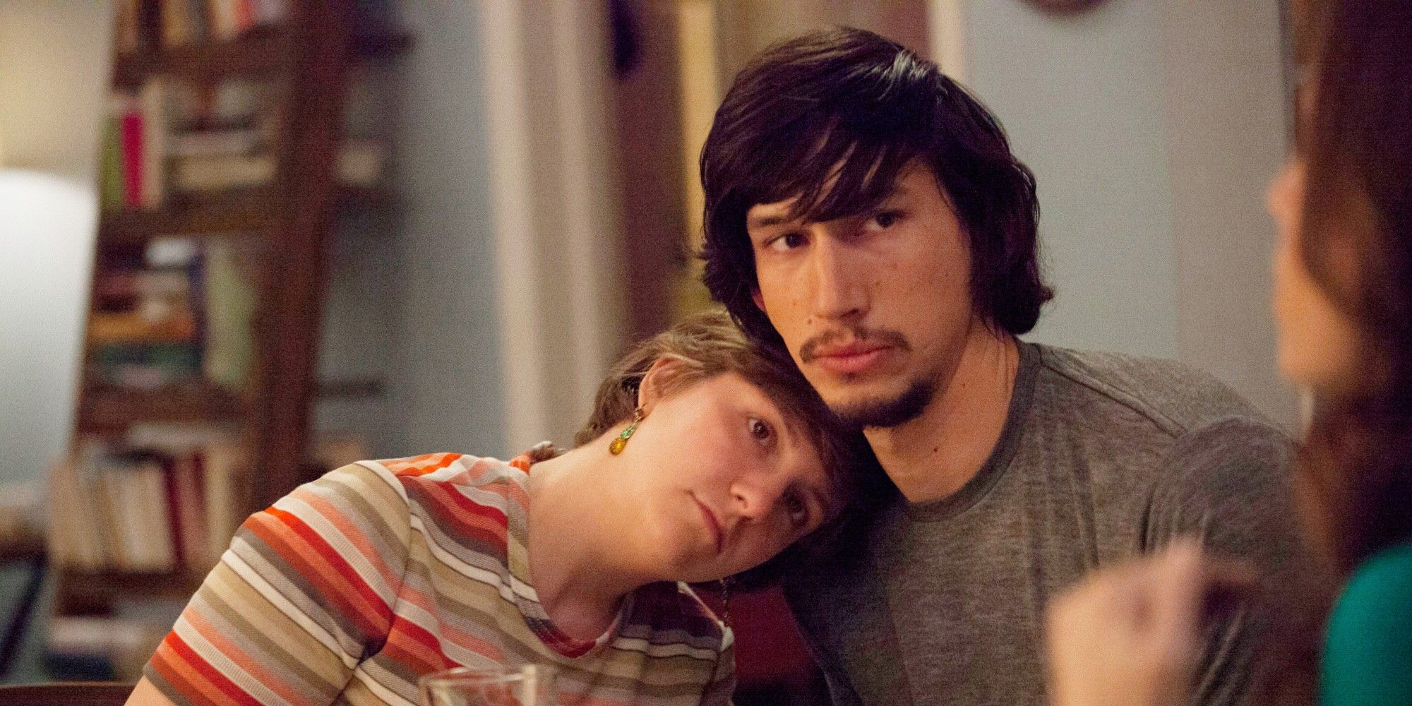 Hannah with her head on Adam’s shoulder in Girls