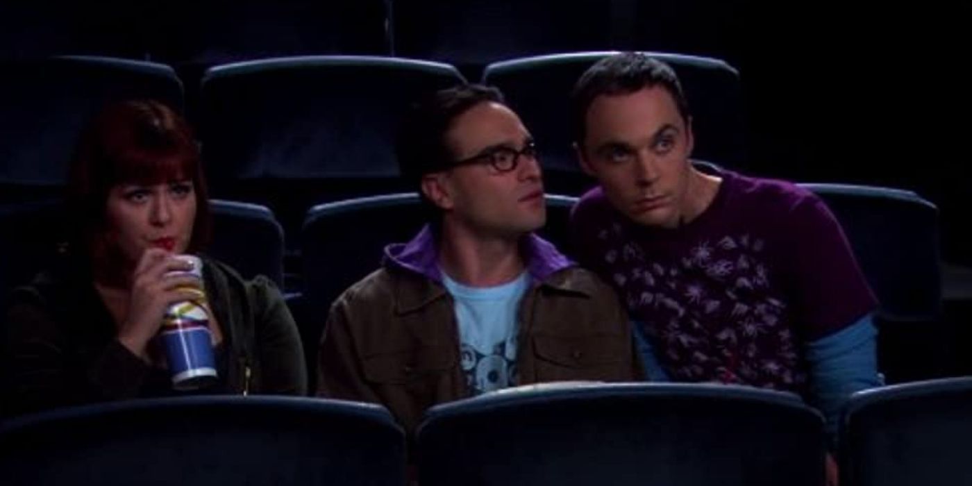 Leonard, Sheldon, and Stephanie sit next to each other at the movies on TBBT
