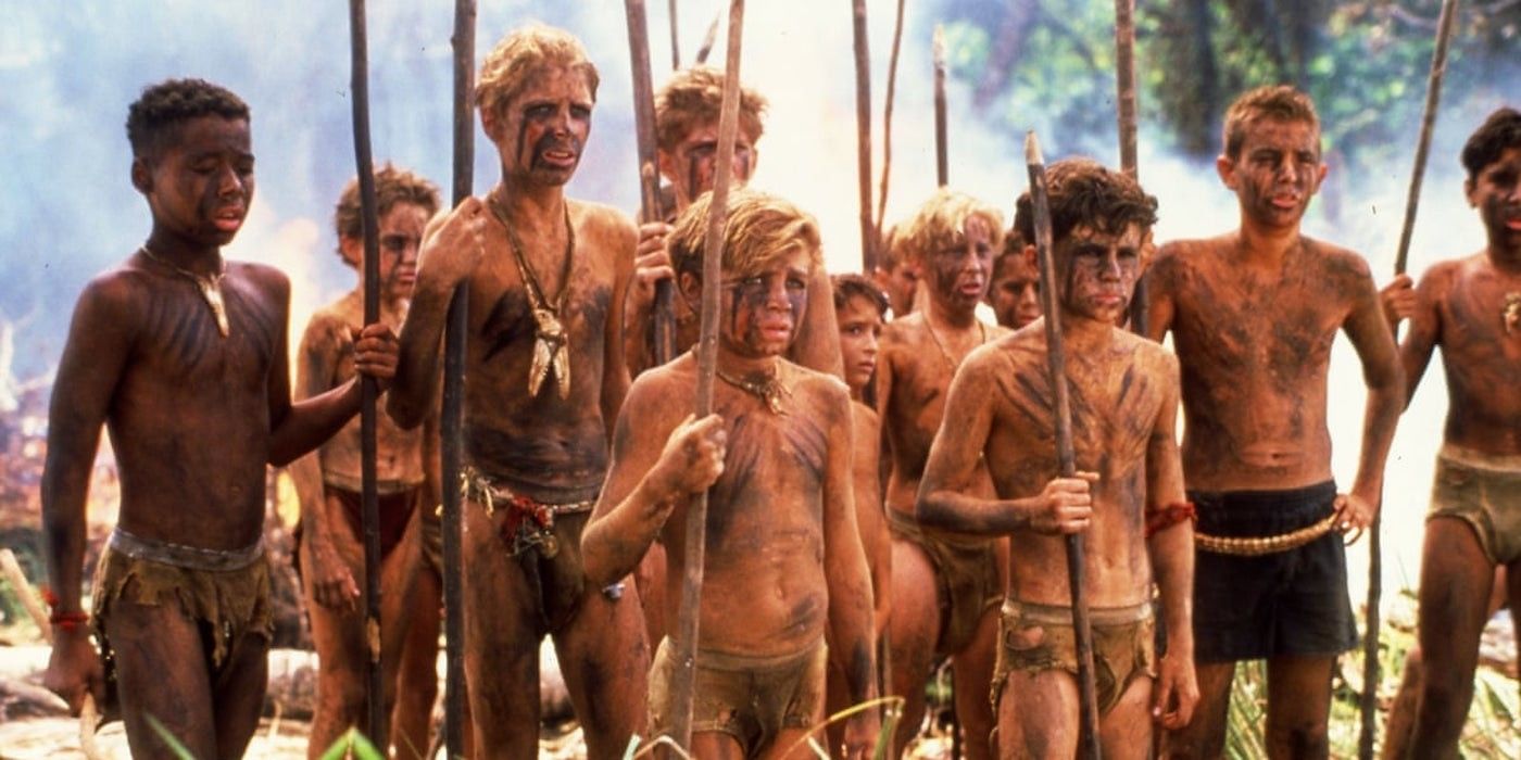 Ralph, Jack, and the rest of the boys holding spears in Lord of the Flies