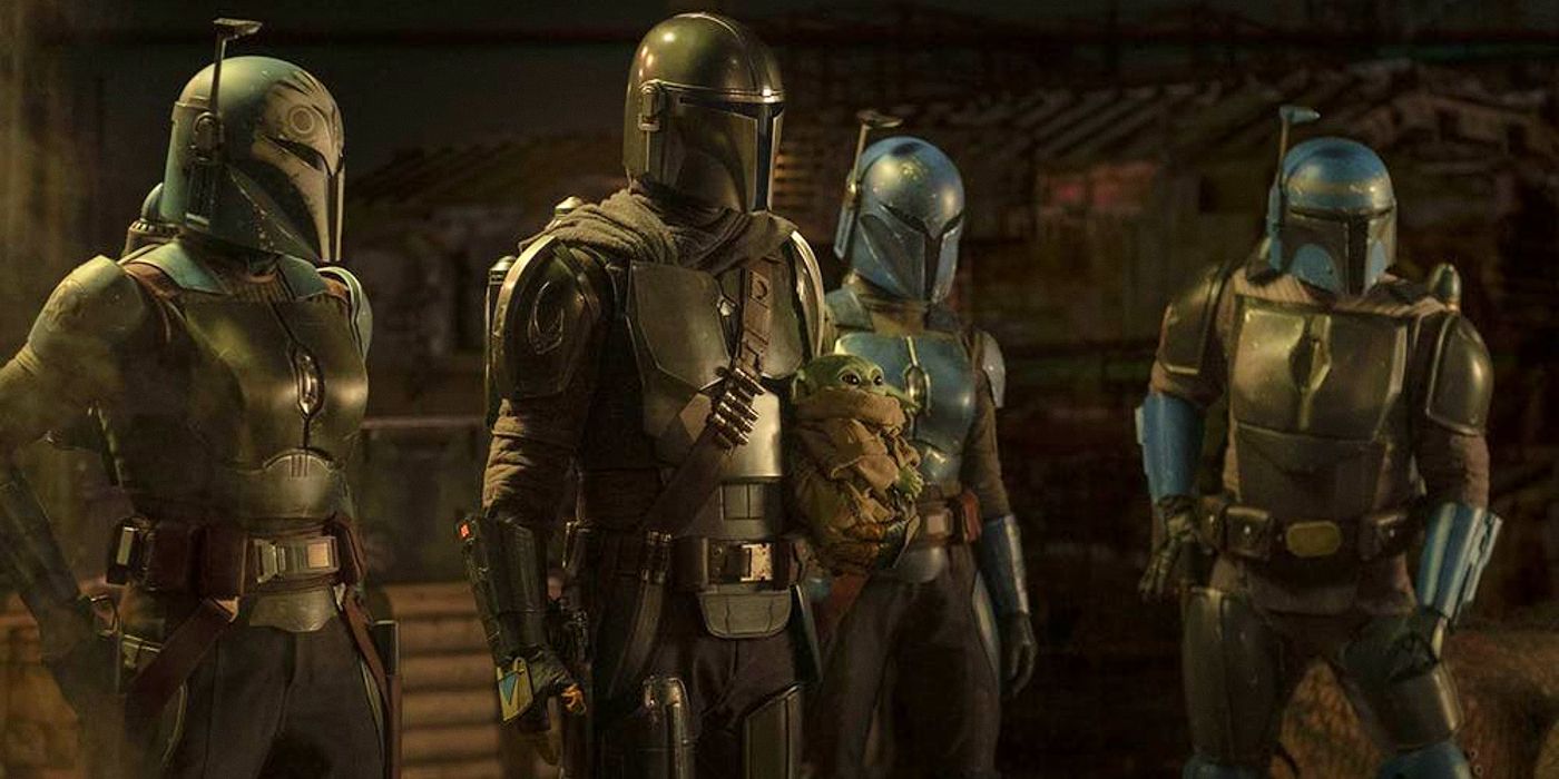Four mandalorians stand next to each other in The Mandalorian.