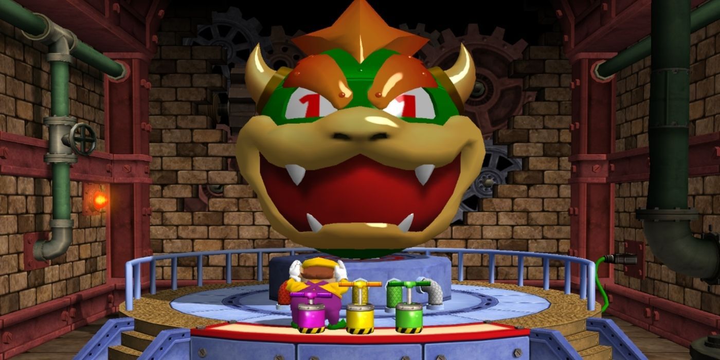 Wario covers his ears while standing before a giant Bowser statue in the mini game Bowser's Big Blast