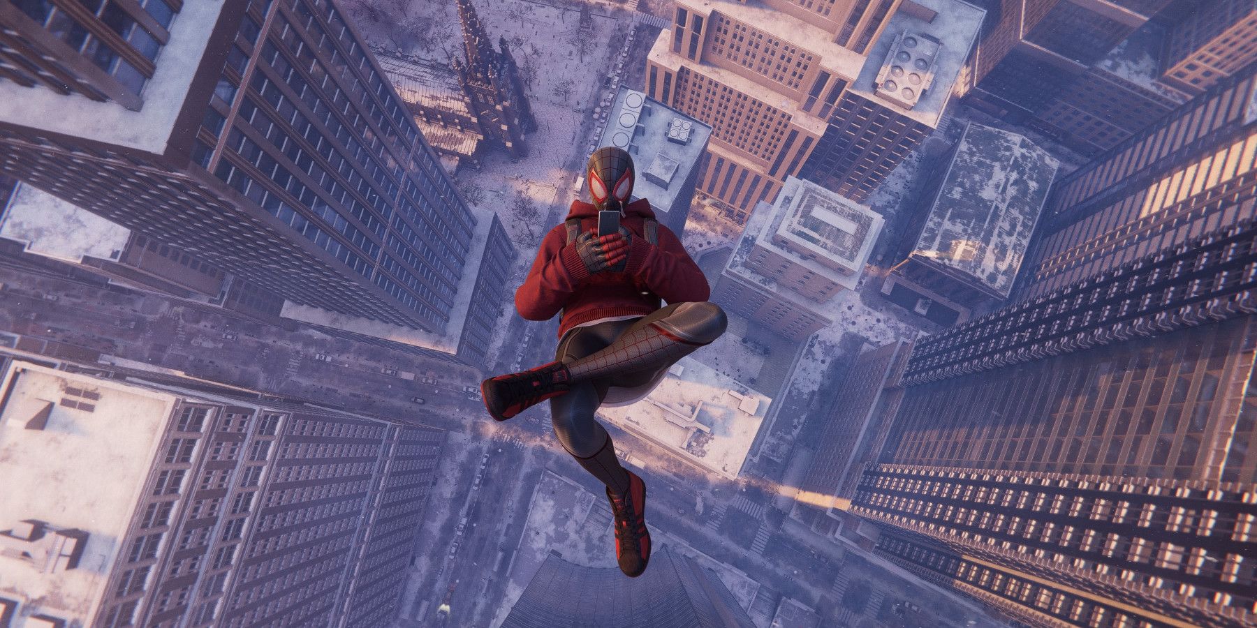 Miles Morales playing on his phone while plummeting to the ground