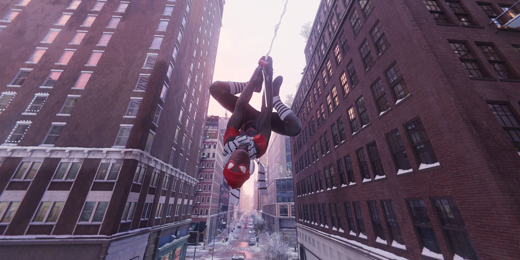 Miles Morales hanging upside-down from a web while wearing a knit scarf and legwarmers