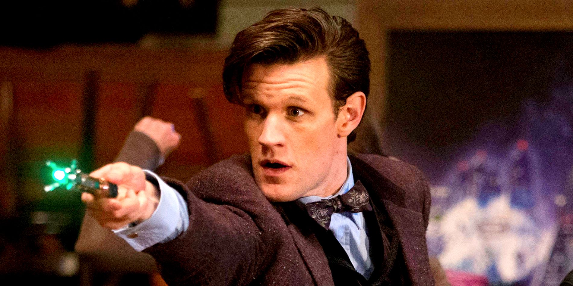 The Eleventh Doctor pointing a device in Doctor Who.