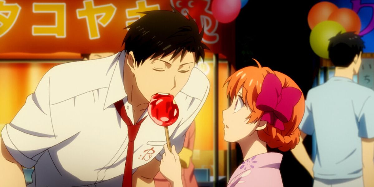 A boy leans down and eats a girl's lollipop in Monthly Girls' Nozaki-Kun.