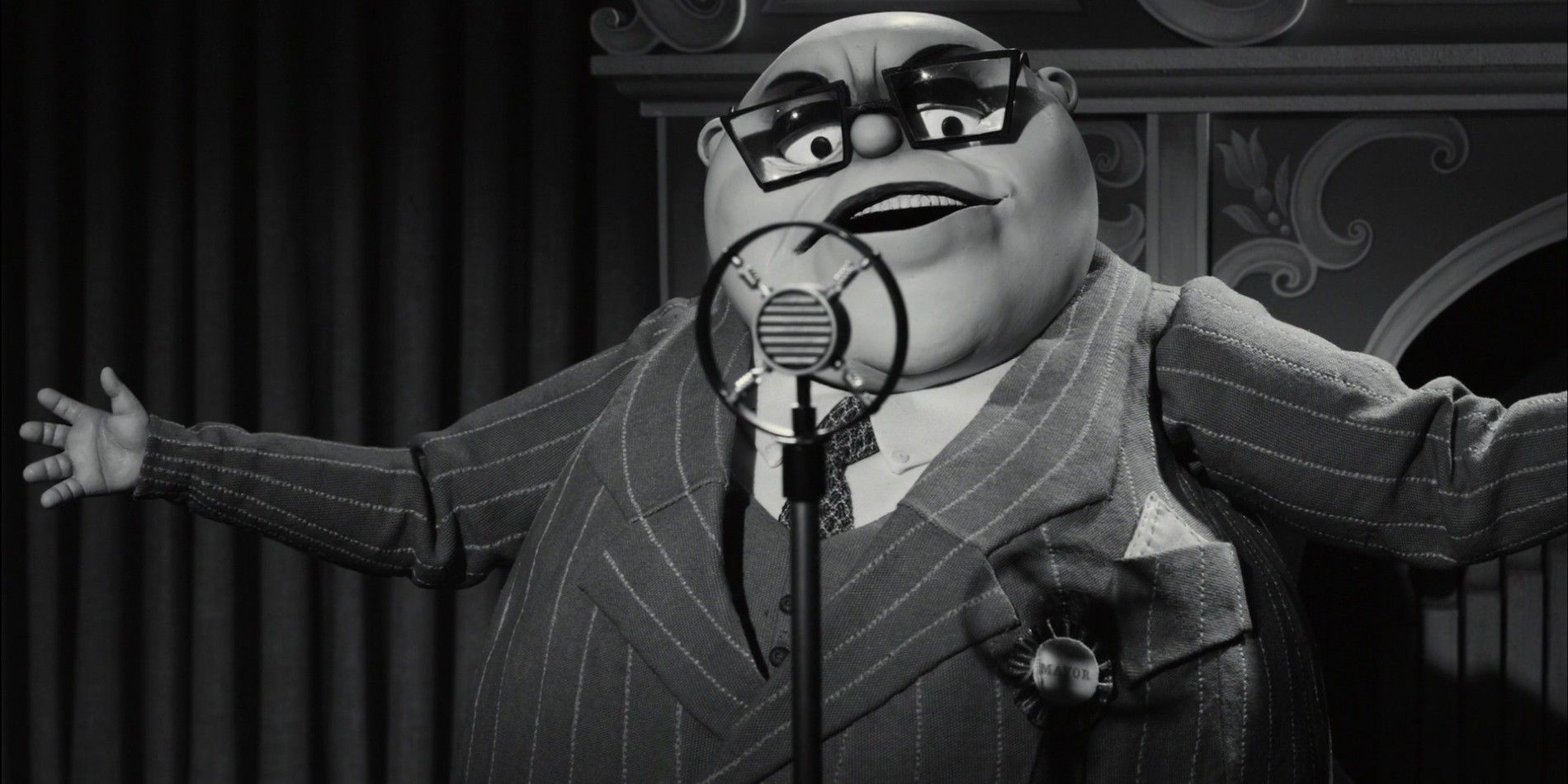 Mr. Burgermeister in Frankenweenie speaking into a microphone