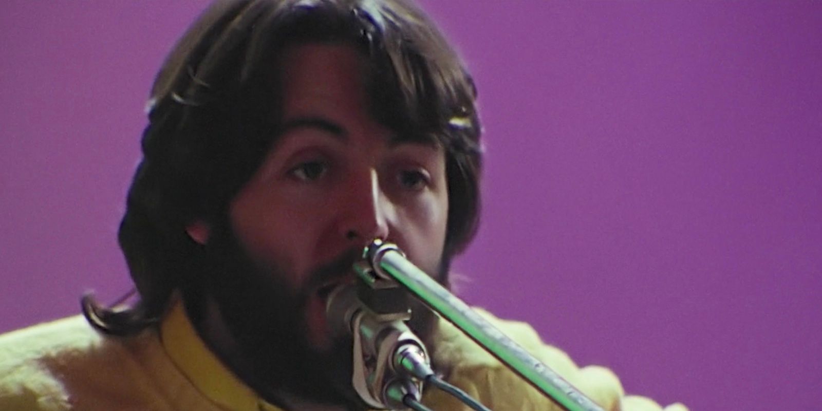 Paul McCartney playing an instrument in The Beatles: Get Back.