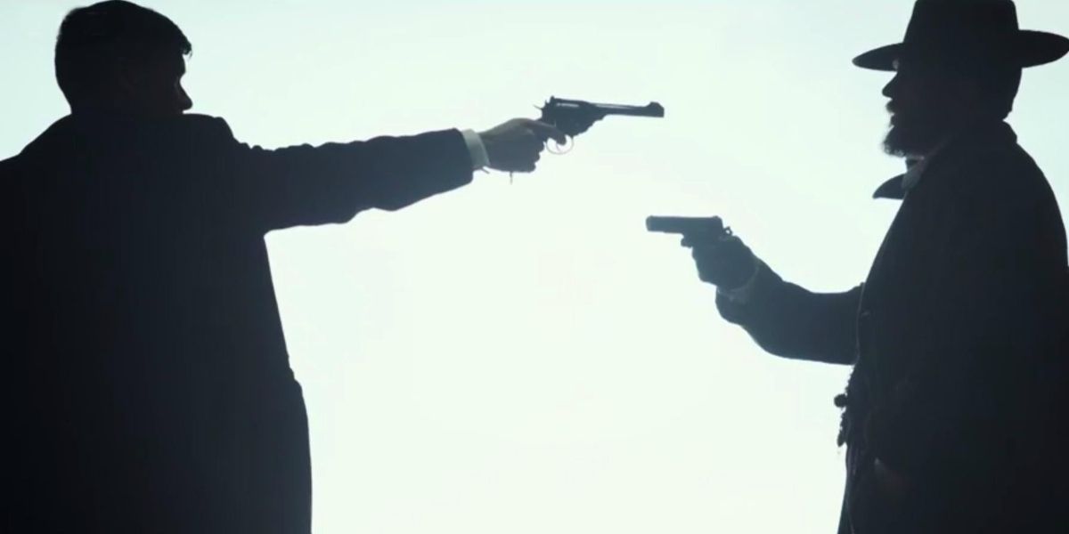 Tommy Shelby (Cillian Murphy) pointing a gun at Alfie Solomons (Tom Hardy) in Peaky Blinders