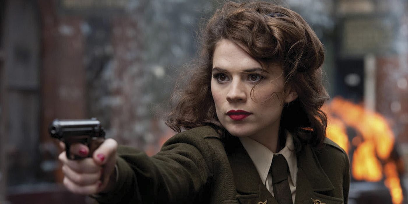 Peggy Carter pointing a gun at someone in Captain America: The First Avenger.