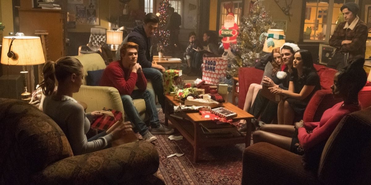 The characters in Riverdale celebrating Christmas in someone's living room