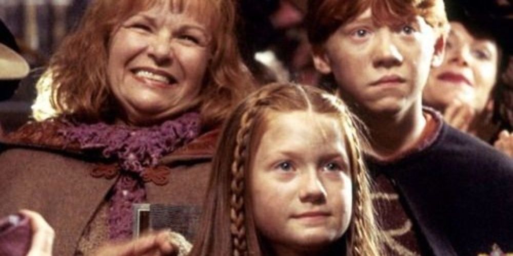 Ron, Molly, and Ginny at Flourish and Blotts in Harry Potter and the Chamber of Secrets