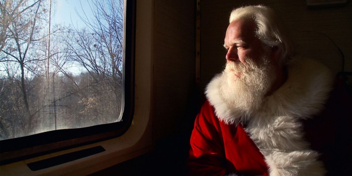 Santa stares moodily out a train window in Becoming Santa