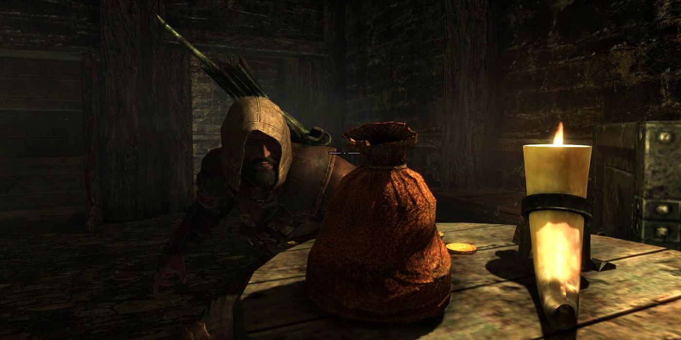 A Skyrim player crouches next to a bag of gold on a table