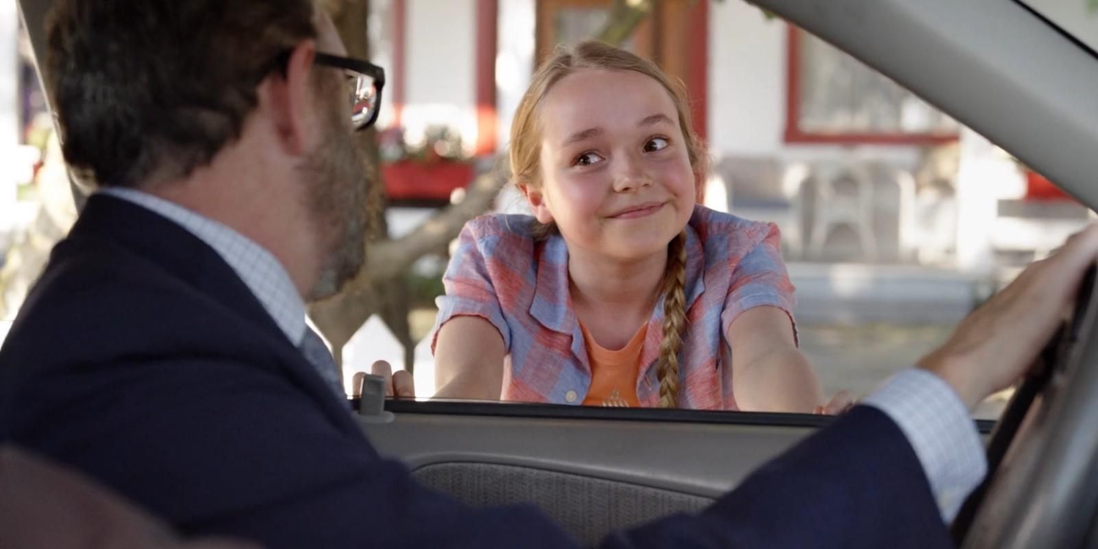 Sophia Reid Gantzert as Lily Lassiter smiles at her father through the car window in Psych 3 This Is Gus