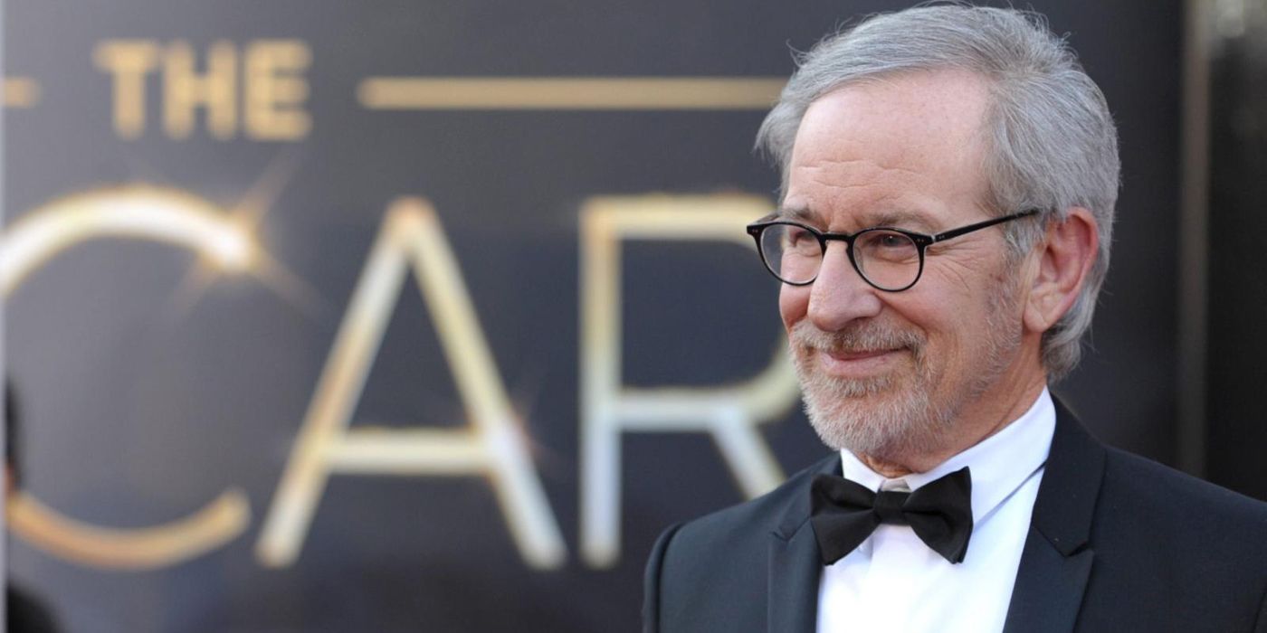 Steven Spielberg standing in front of an Oscars sign.