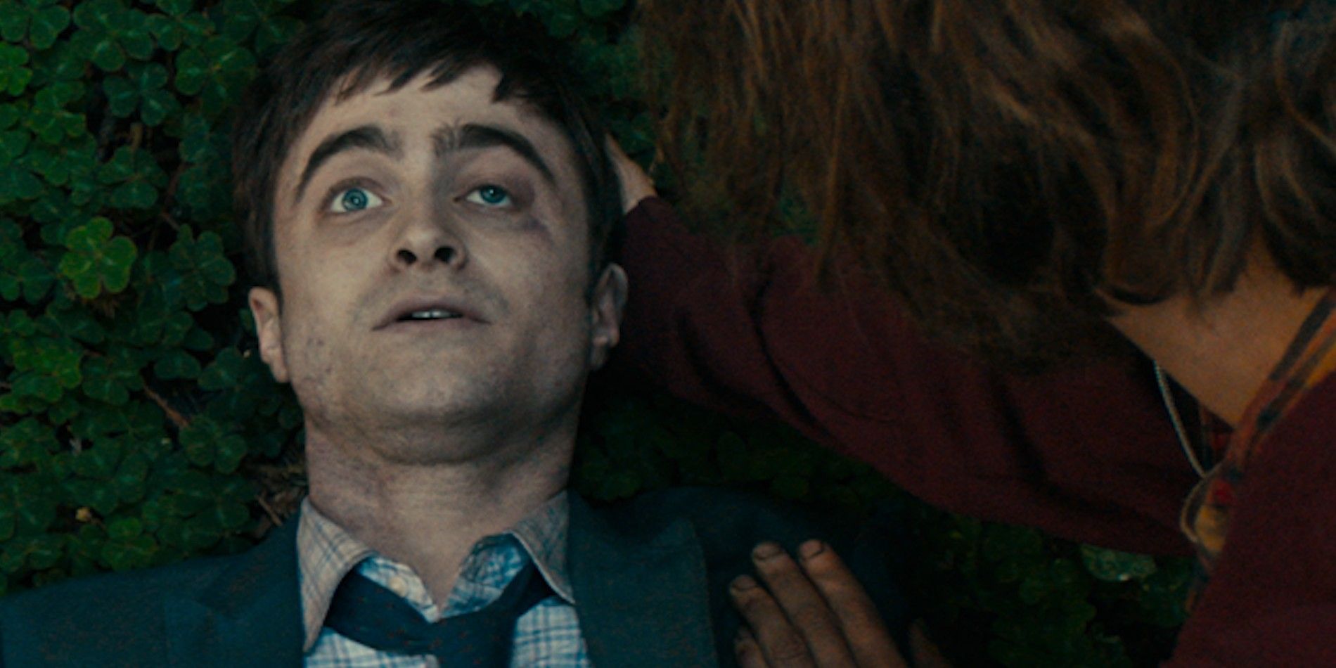 Manny lying down and looking scared in Swiss Army Man