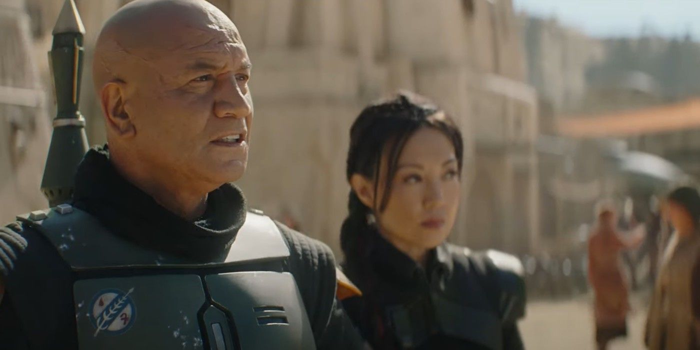Temuera Morrison as Boba Fett and Ming Na Wen as Fennec Shand standing in a town in Book of Boba Fett
