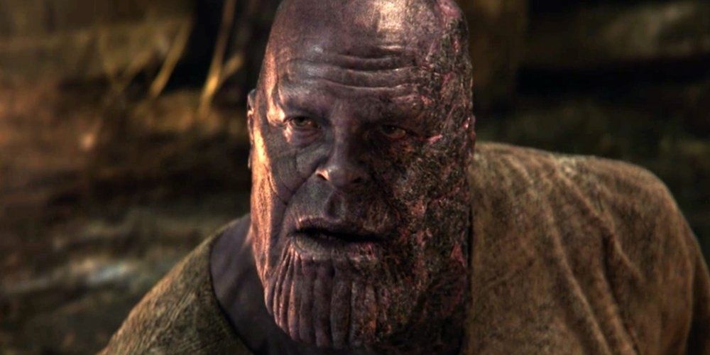 A badly burned Thanos looking up in Avengers Endgame