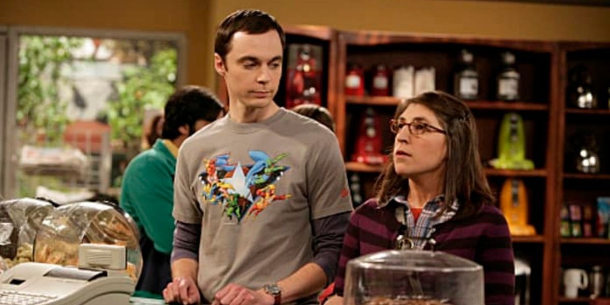 Sheldon looking at Amy as she orders food in The Big Bang Theory