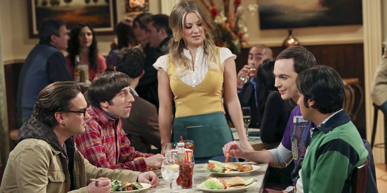 Penny serves the guys food in a restaurant in The Big Bang Theory