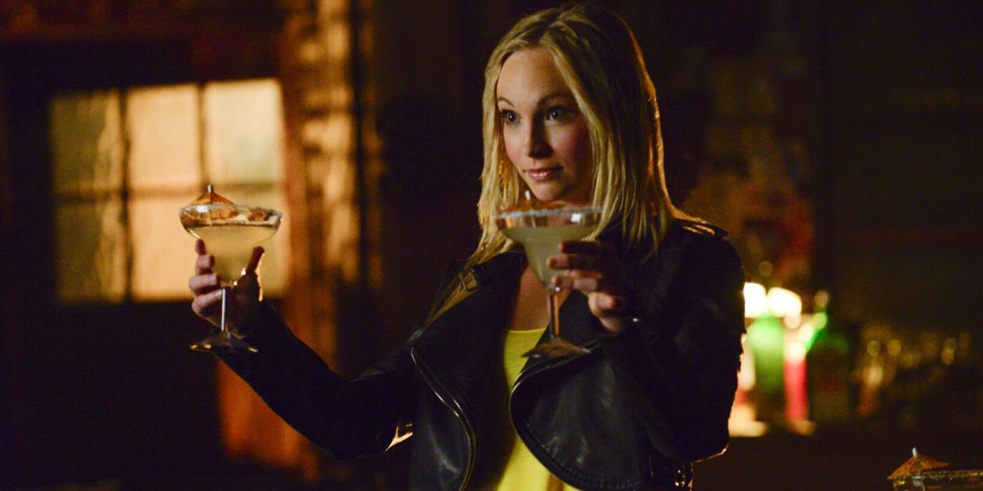 Caroline holding up a drink on The Vampire Diaries