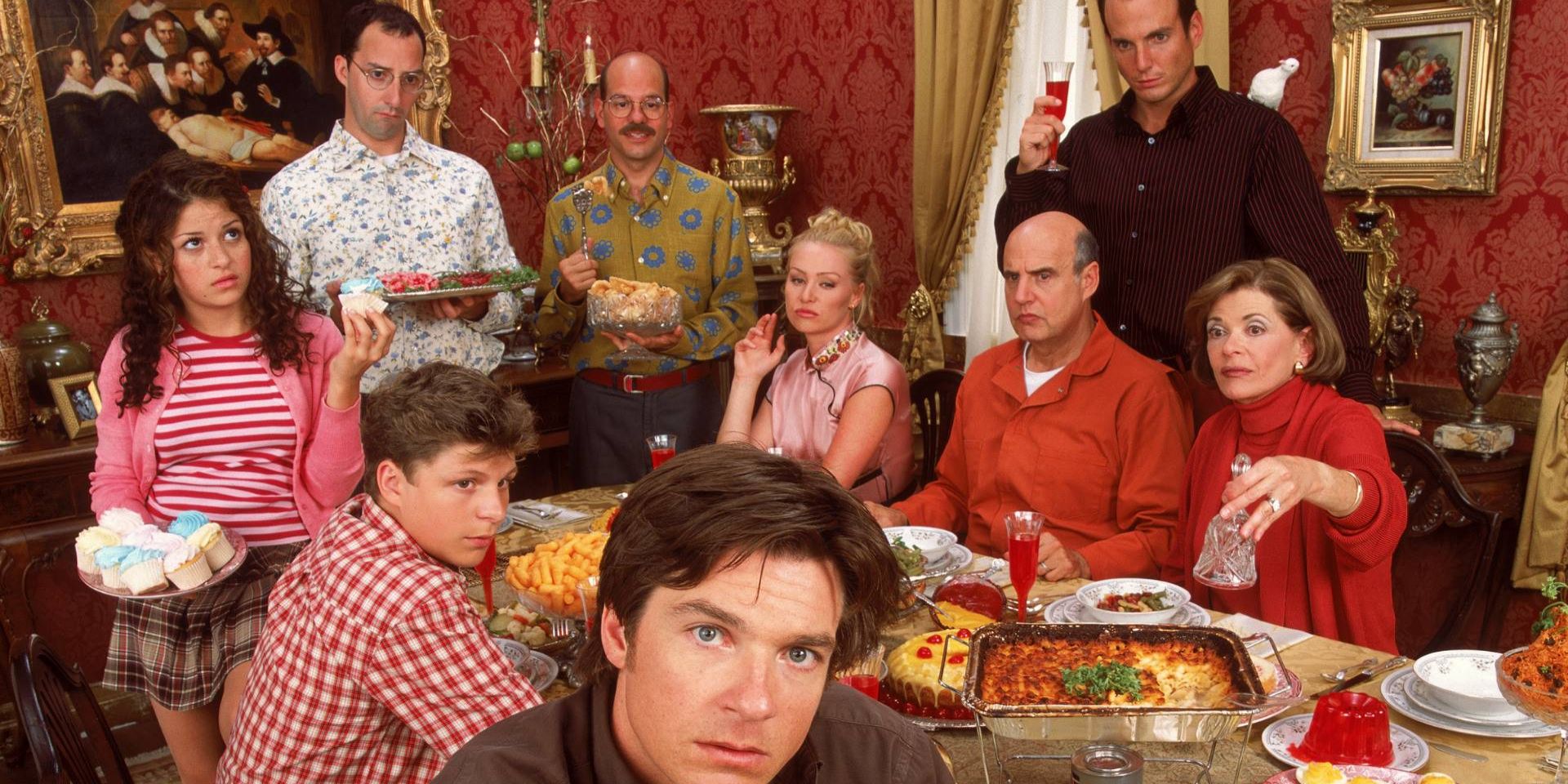 The Bluth family eats dinner at a table in Arrested Development.