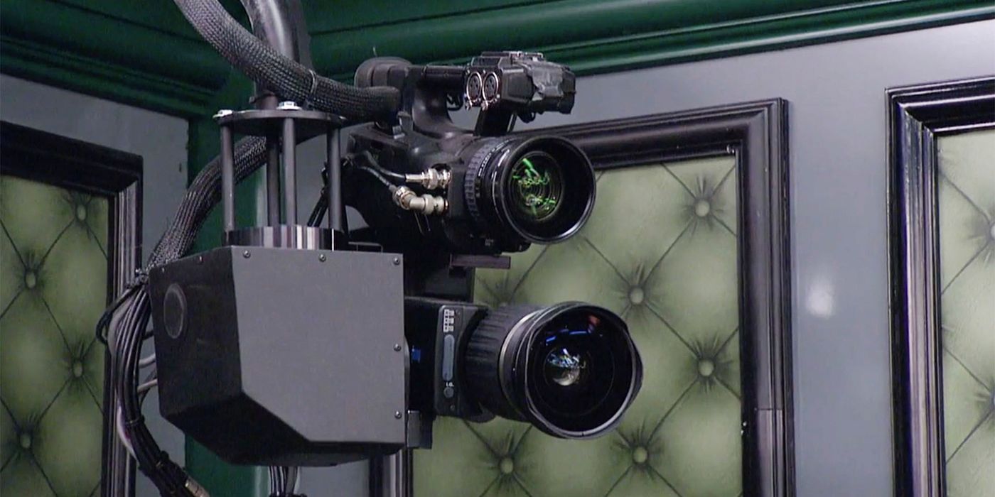 Close up of a camera in the Big Brother house, mounted to the wall.