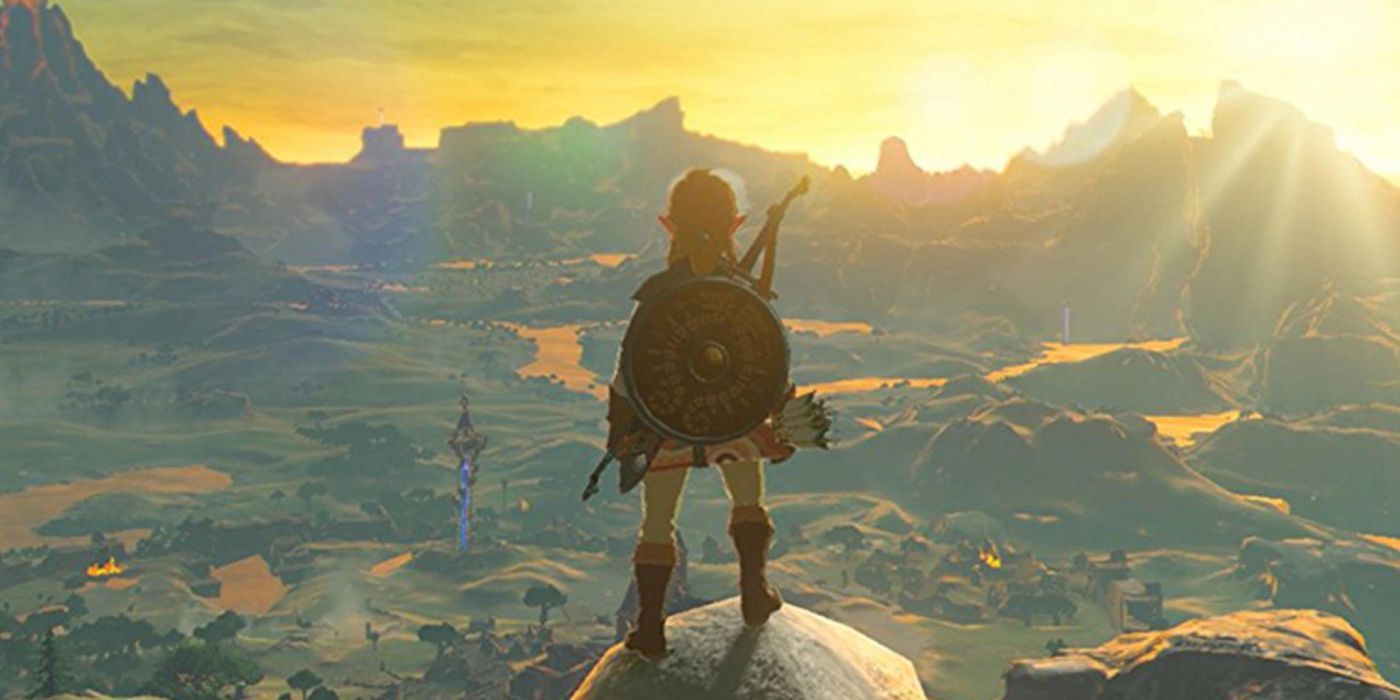 Zelda standing in front of the landscape as the sun sets in Breath of the Wild sets