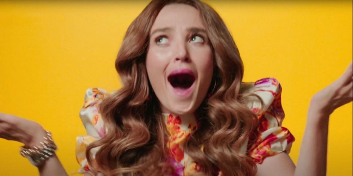 Chloe Fineman as Drew Barrymore shrugging on a yellow background similar to her talk show in a skit from SNL.