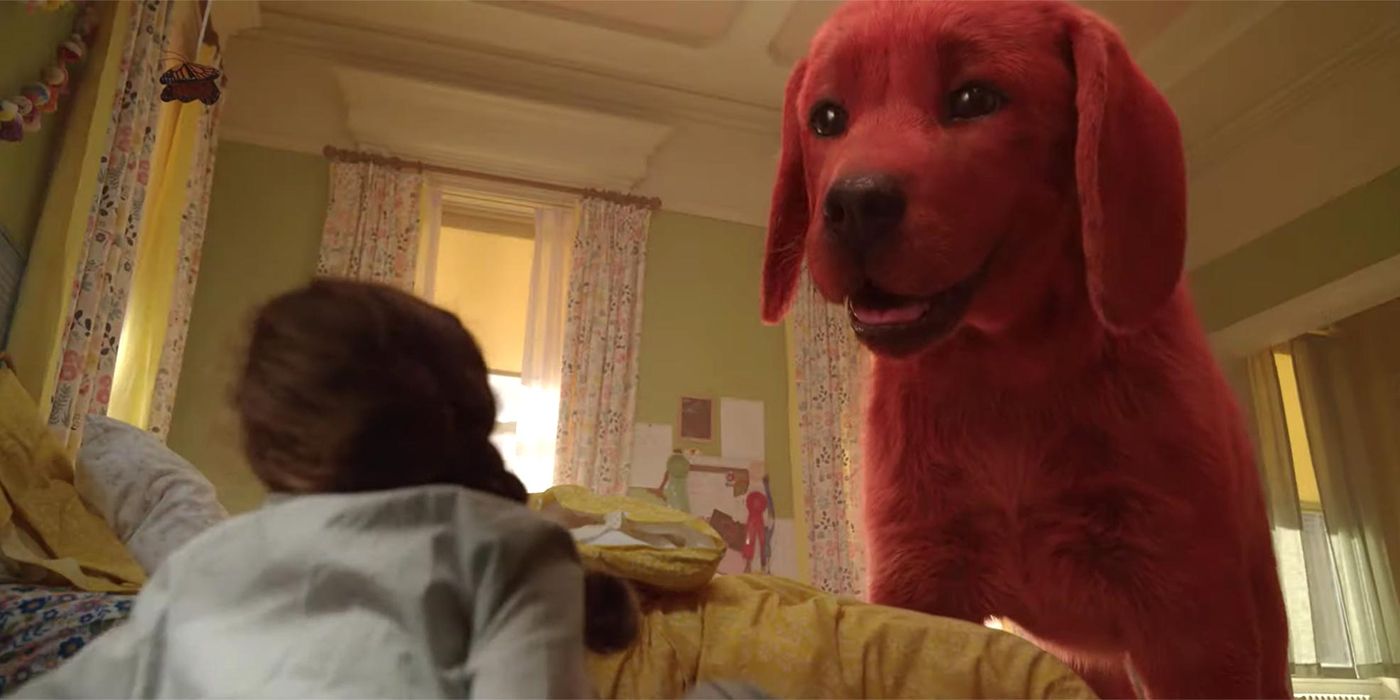 Clifford the Big Red Dog looking at a girl on the floor