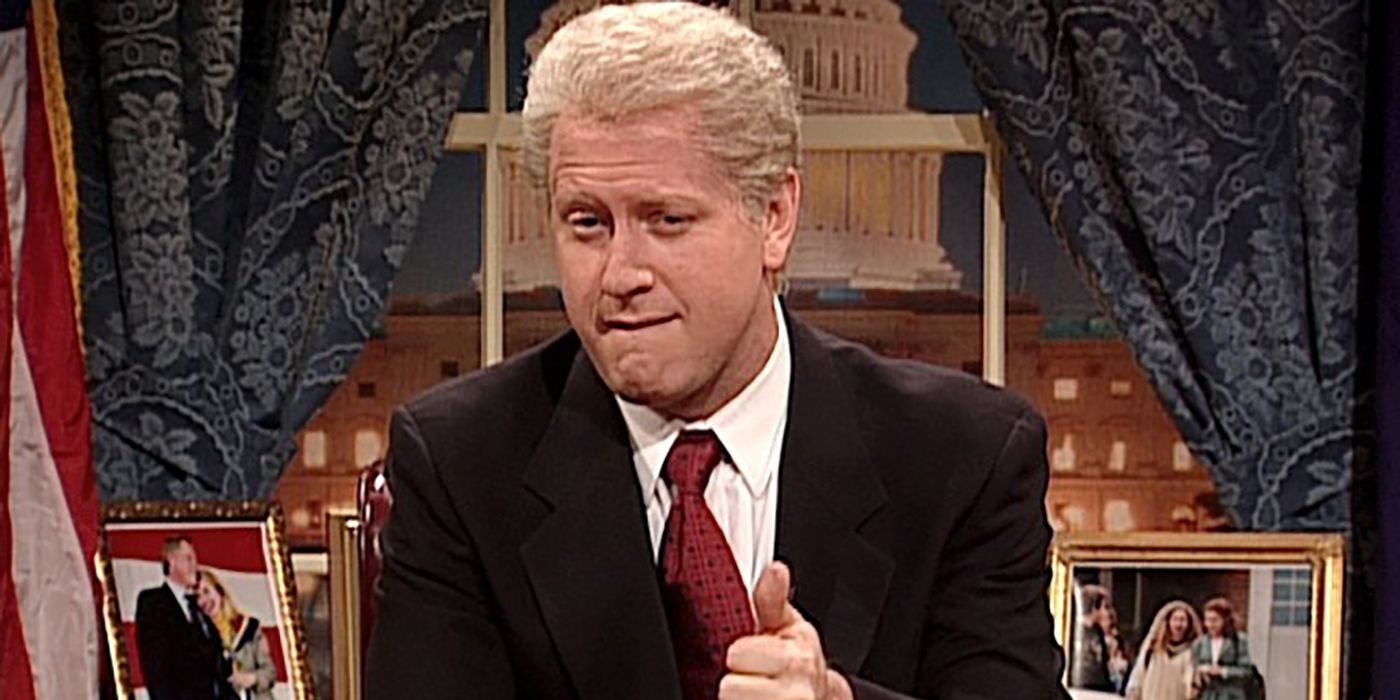 Darrell Hammond as Bill Clinton sitting at a desk in a sketch from Saturday Night Live.