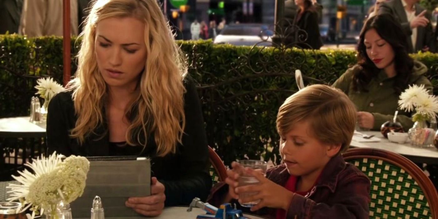 Hannah sitting at a restaurant with a young Harrison on Dexter.