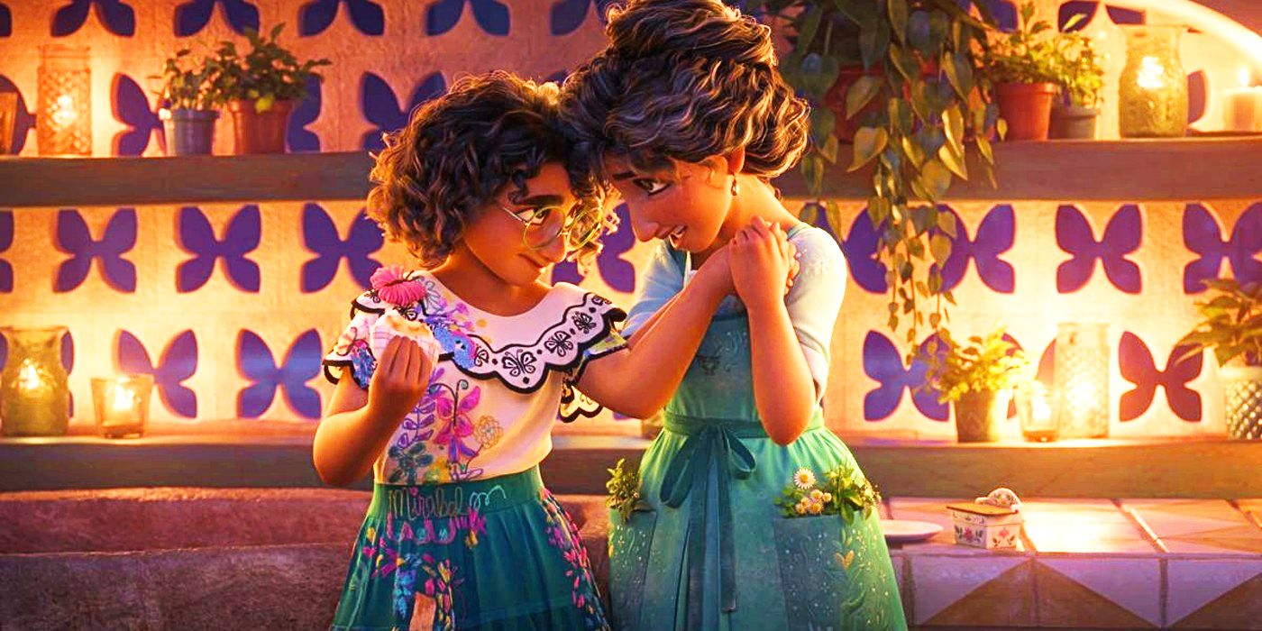 Julieta and Mirabel touch heads and hands in Disney's Encanto.