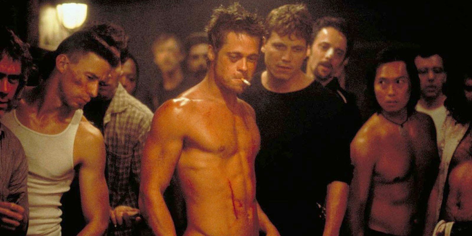 Tyler standing in the middle of a group of men in Fight Club.